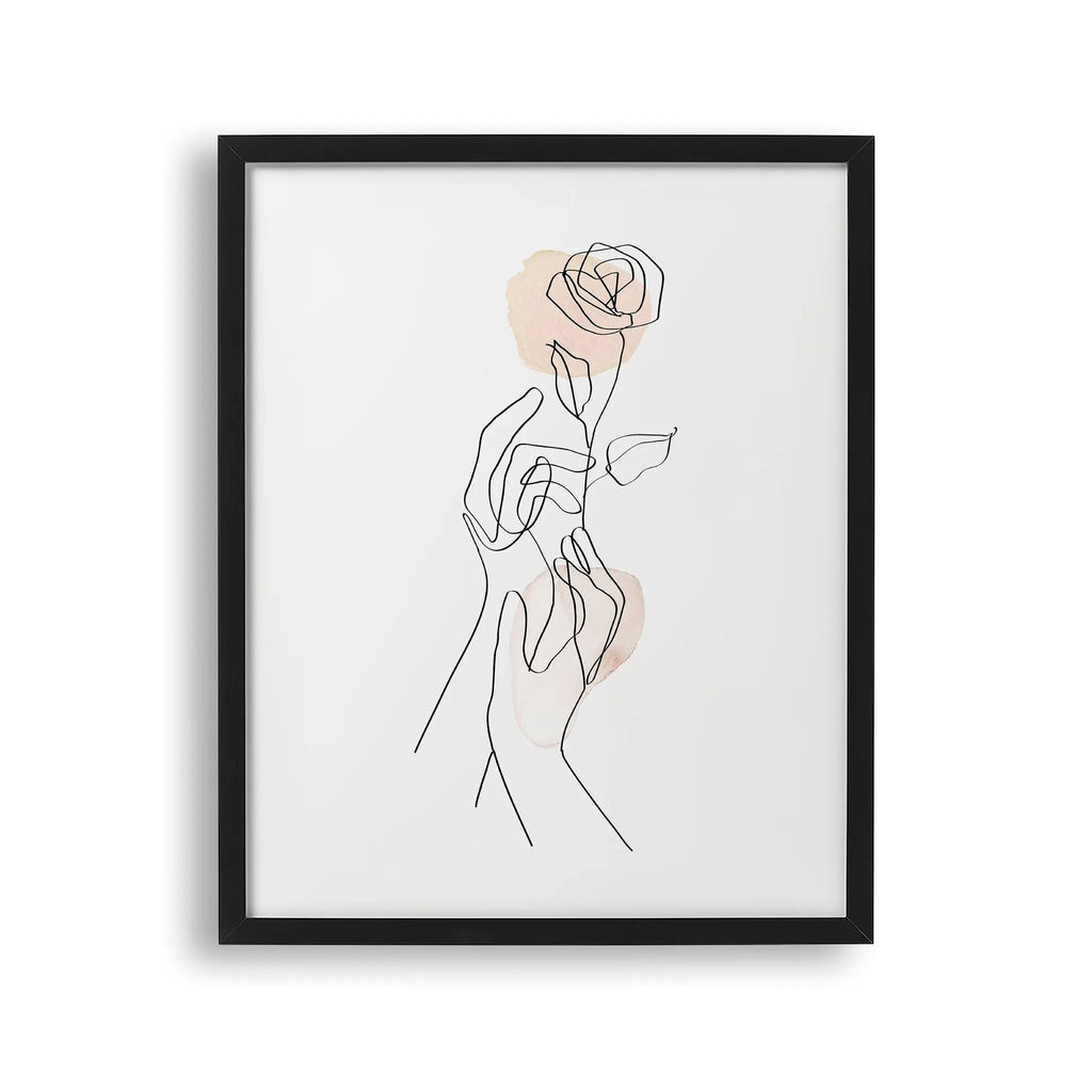 Tabloul cu rama care ilustreaza un desen line art simplu si elegant cu 2 maini tinand un trandafir gentle gesture