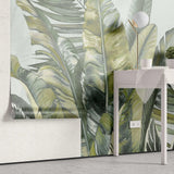Tapet personalizat leaf cu frunze tropicale exotice in nuante de verde pe un fundal verde menta exotic green leaves